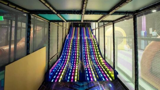Picture of two slides that have lights inside that flash at Area51 playcentre in Underwood and Mt Gravatt